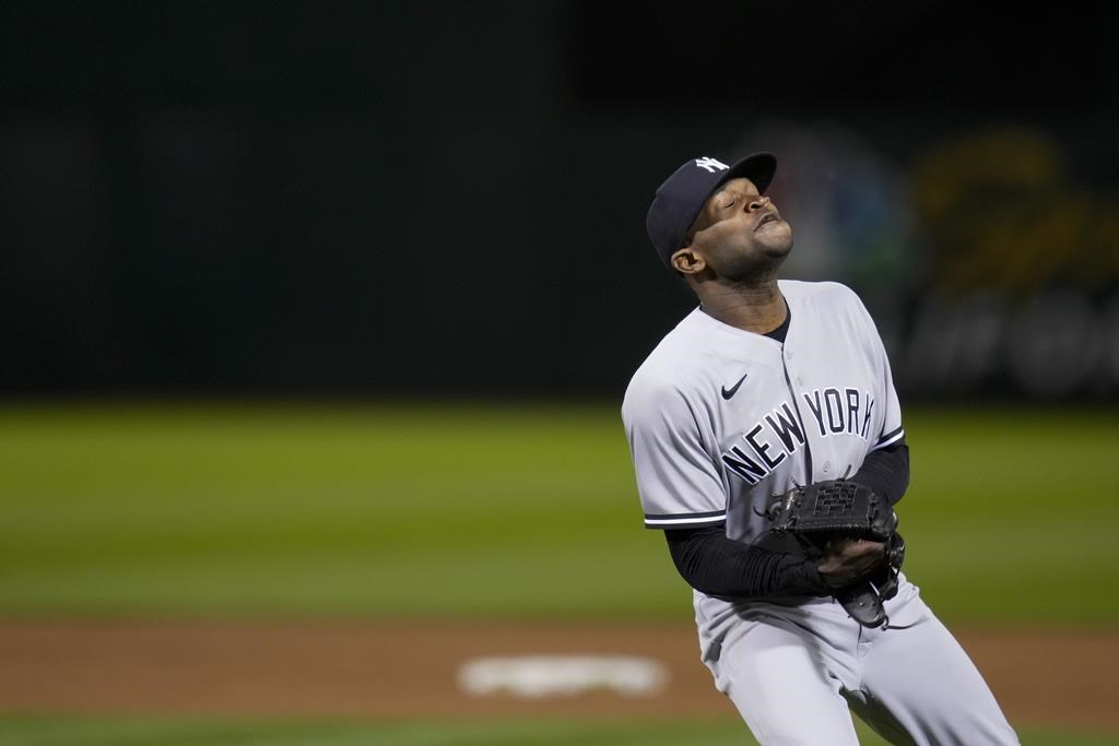 ANAHEIM, CA - JULY 18: New York Yankees pitcher Domingo German (0) pitching  during an MLB baseball game against the Los Angeles Angels played on July  18, 2023 at Angel Stadium in