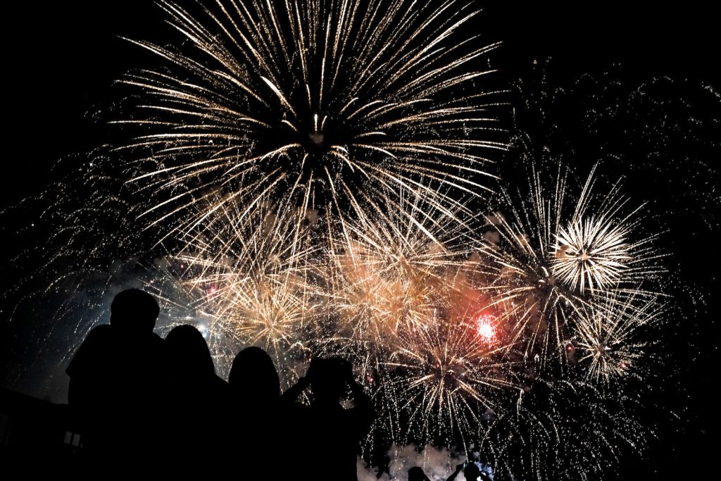 a group of people watching a fireworks display