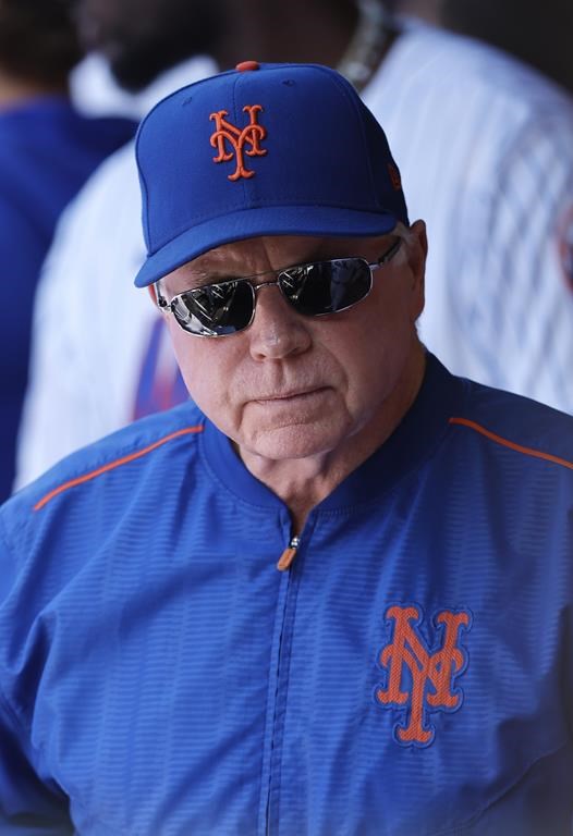 New York Mets manager Buck Showalter watches from the dugout