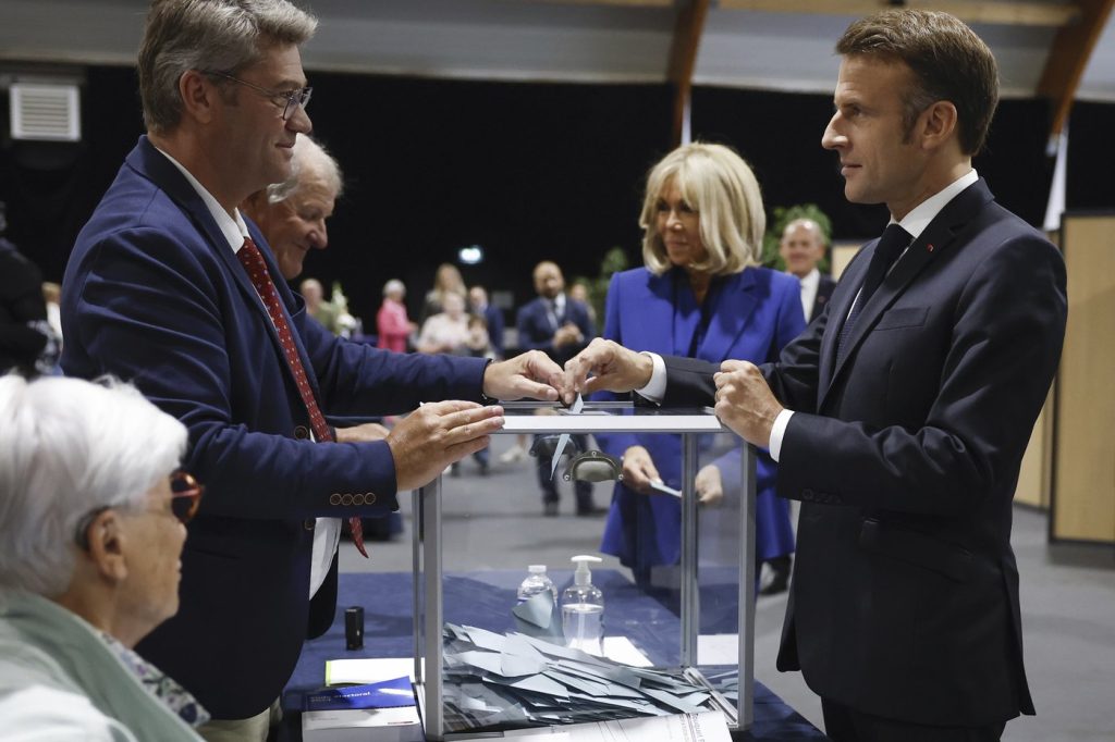 France is voting in a key election that could force Macron to share power with the far right