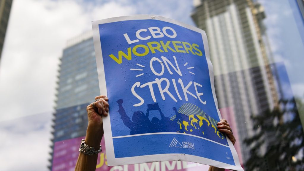 LCBO workers and supporters hold a strike rally at a picket line in front of an LCBO store, in Toronto on Saturday, July 6, 2024. Approximately 10,000 workers at the Liquor Control Board of Ontario walked off the job July 5 after negotiations broke now, although the union that represents them said they were heading back to the bargaining table Wednesday. THE CANADIAN PRESS/Christopher Katsarov