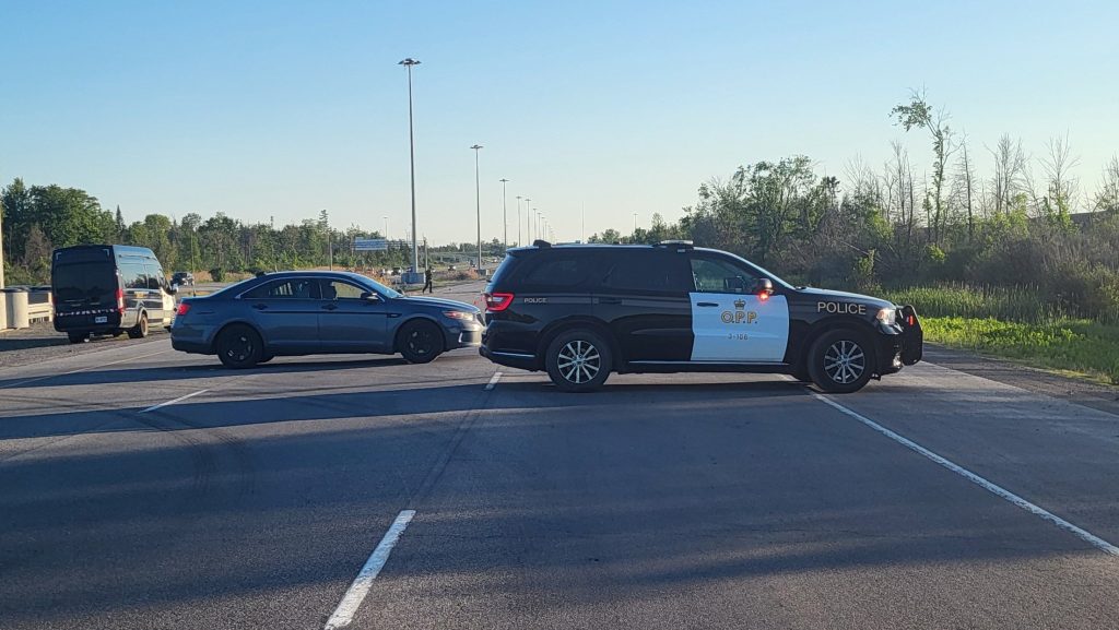 A police cruiser can be seen on Highway 417 blocking traffic to a serious crash on May 31, 2024. (OPP)