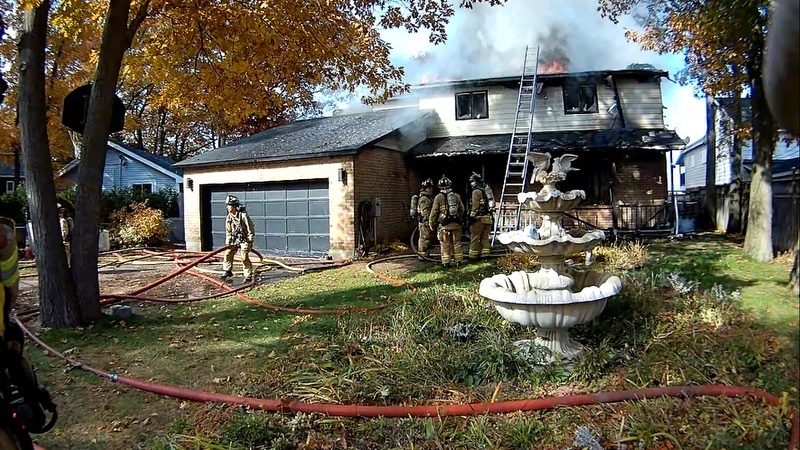 Firefighters shuttle in water while battling blaze in Constance Bay