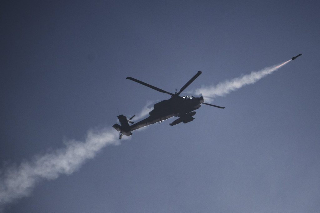 Israeli strikes kill a family of 8 in Gaza and destroy a century-old market in Lebanon