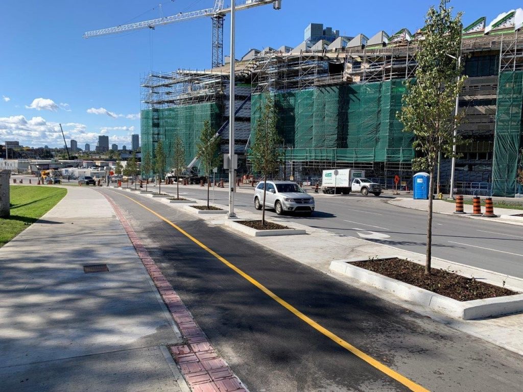 Infrastructure enhancements also include new bi-directional cycling lanes and sidewalk along Slater Street from Bronson Avenue towards Albert Street. This includes trees in soil cells along the route. Photo by City of Ottawa.