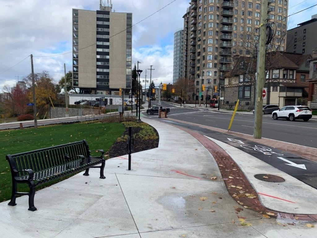 New street furniture, sidewalk, and cycle track are now featured on Bronson Avenue. Photo by City of Ottawa.