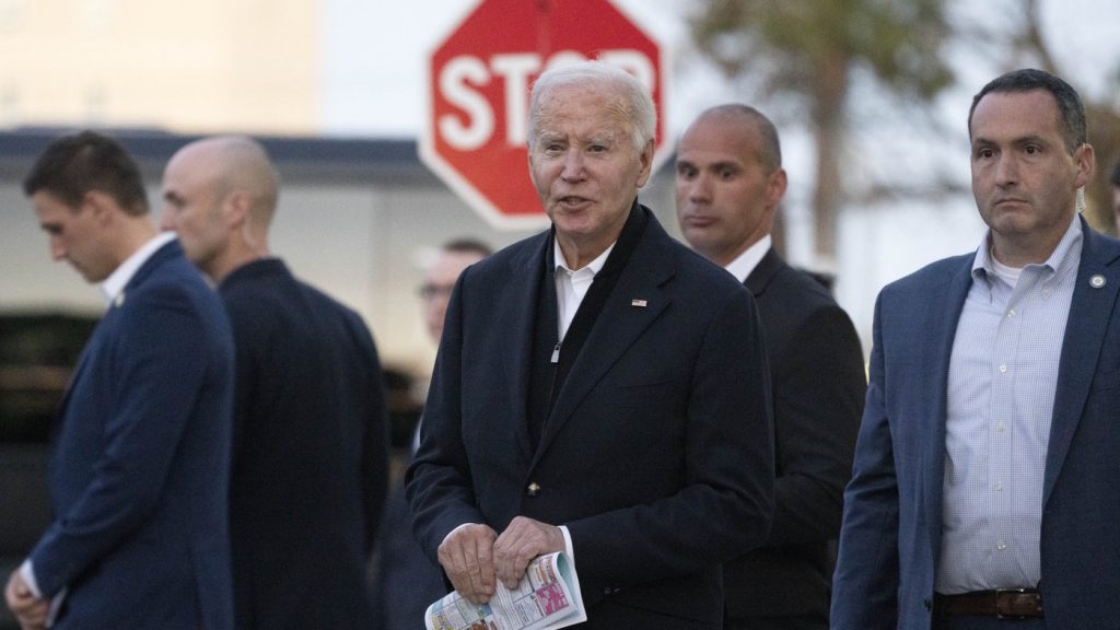 President Joe Biden responds to reporters' questions as he leaves St. Edmond Roman Catholic Church in Rehoboth Beach, Del., after attending mass, Saturday, Nov. 9, 2024.