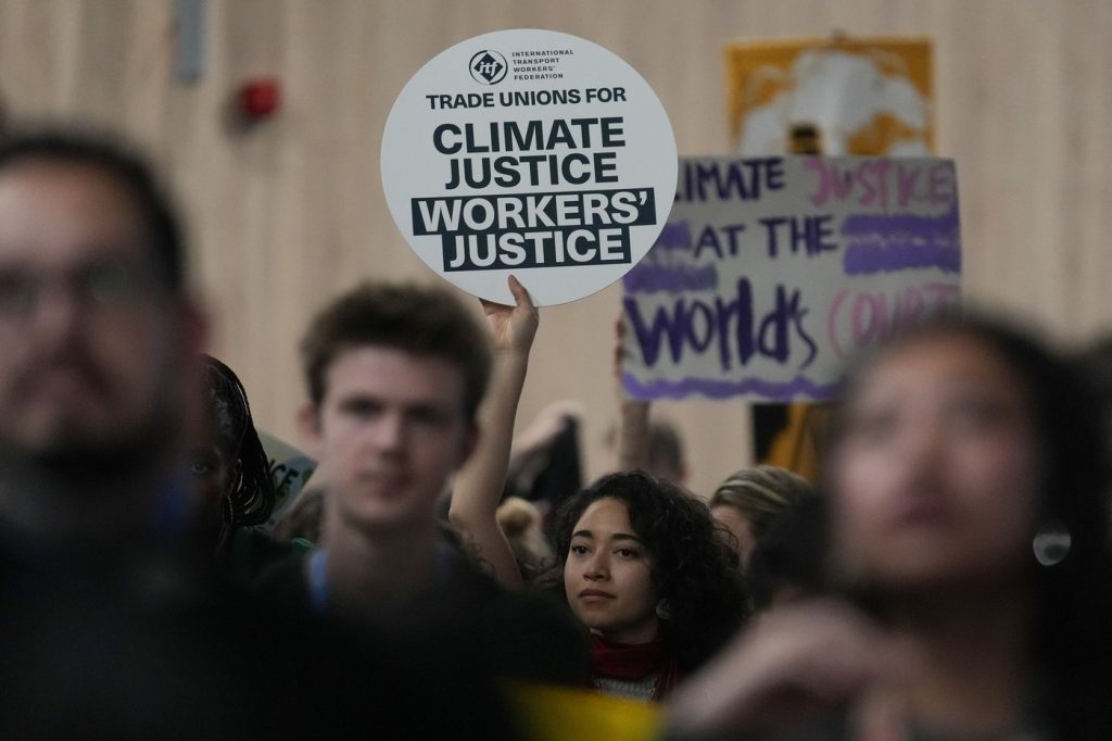 Protesters gather at UN climate talks in global day of action as progress on a deal slows