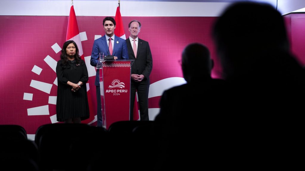 Prime Minister Justin Trudeau holds a closing press conference with Export Promotion, International Trade and Economic Development Minister Mary Ng and Ian McKay, Ambassador of Canada to Japan and Special Envoy for the Indo-Pacific, following the APEC summit in Lima, Peru on Saturday, Nov. 16, 2024. THE CANADIAN PRESS/Sean Kilpatrick