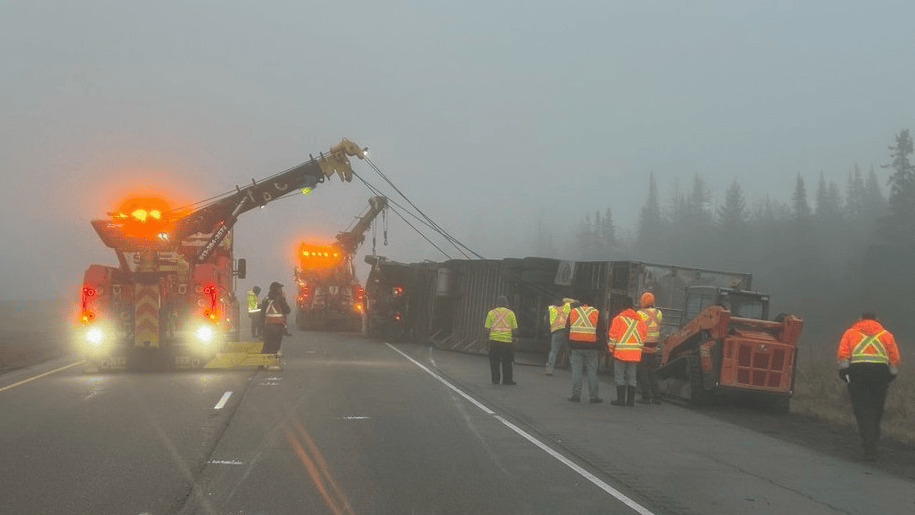 Tractor-trailer slides off highway carrying tomatoes