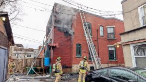 Crews tackle black smoke, flames from Lowertown building